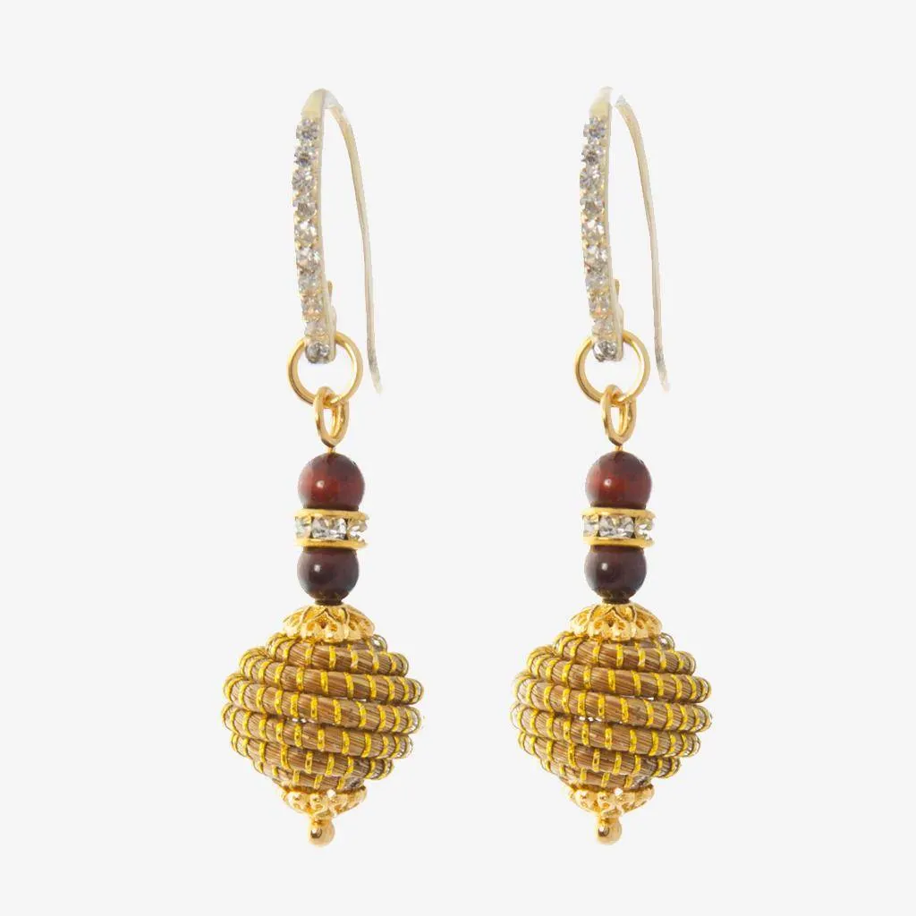 Uriel Earrings in Garnet — golden grass jewelry designed by Orit, handwoven in the Cerrado, Oroboros